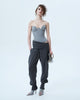 Trousers with asymmetric draped belt