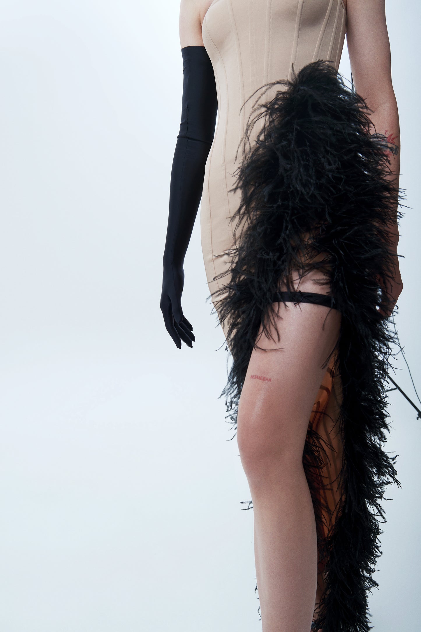 Floor-length corset dress with feather