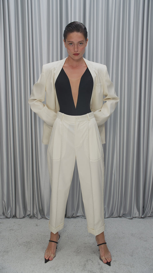 Stitched trousers with transparent pockets